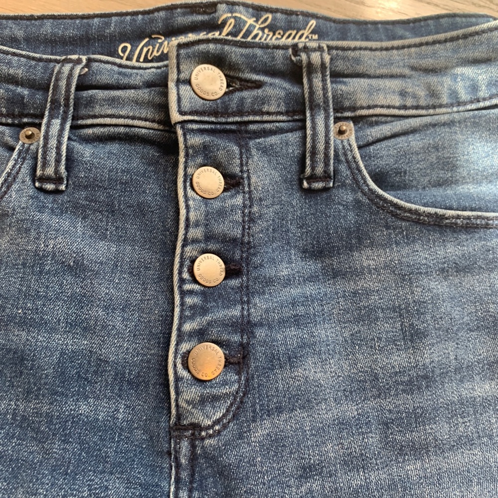 High rise skinny jeans with button fly